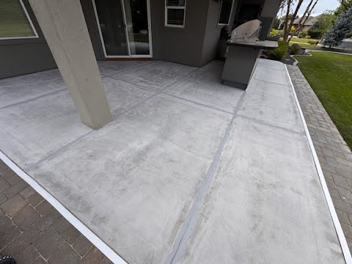 Before — Scored concrete, weathered and stained